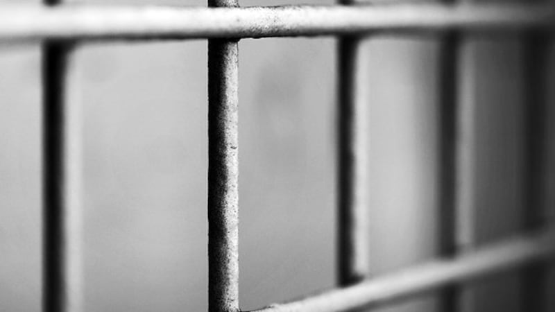 Photo depicting jail cell bars