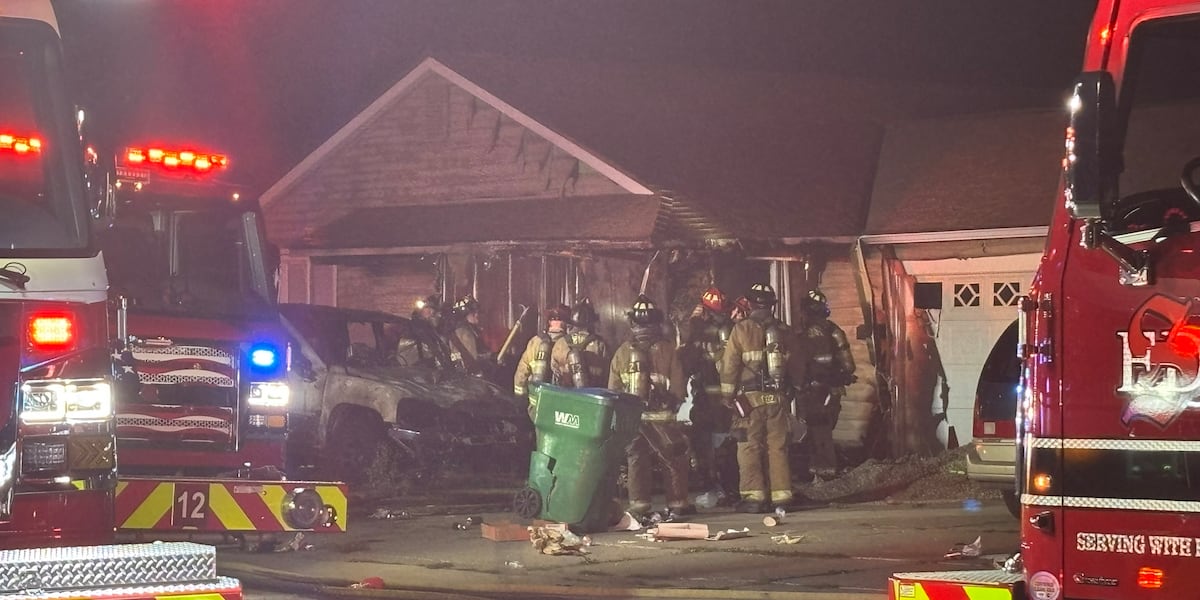 Man in custody after pickup crash sets Sparks home on fire