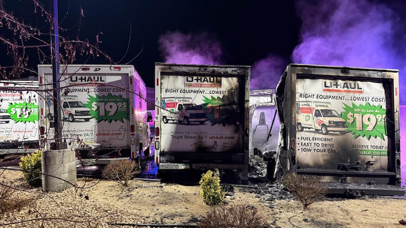 Two U-Haul trucks were fully engulfed in flames.