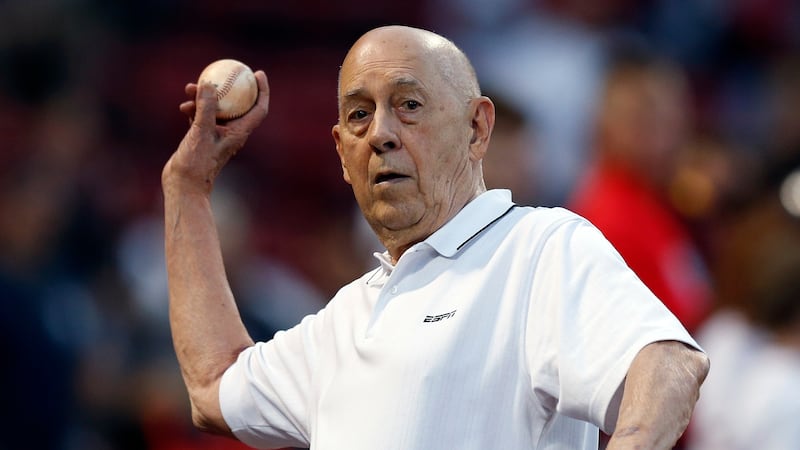 Founder of ESPN Bill Rasmussen tosses a ball before a baseball game between the Boston Red Sox...